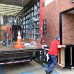 movers bring furniture into Arnold Hall